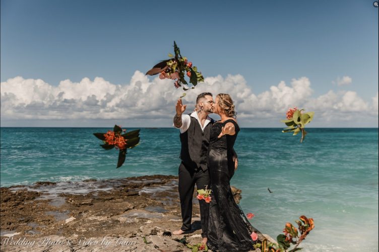 Wedding couple throwing bouquets at their photographer in Bimini